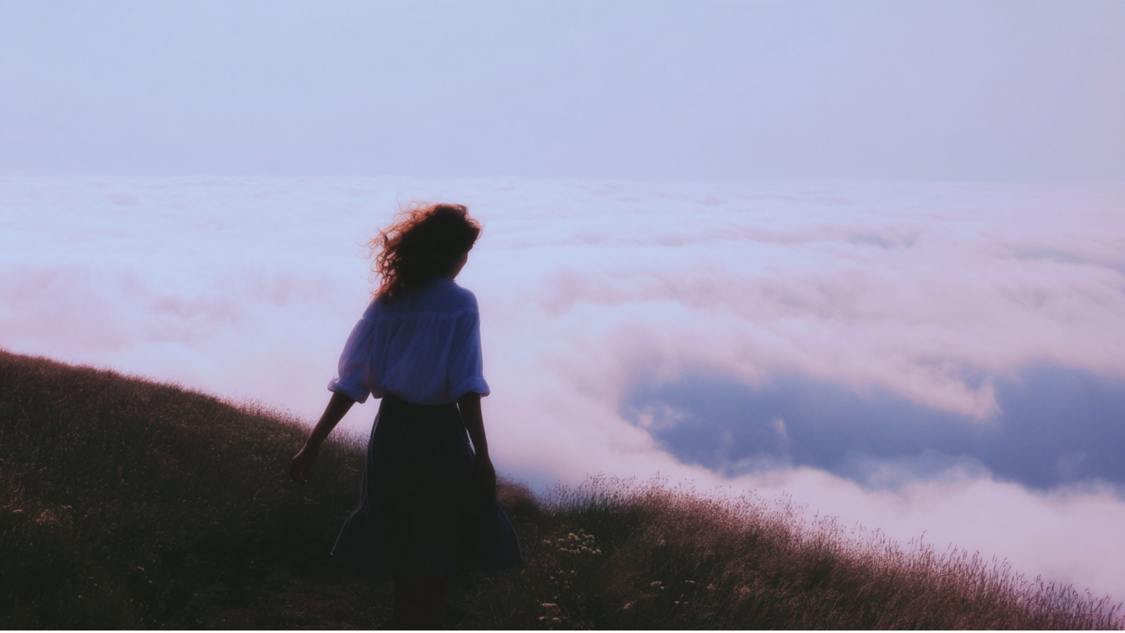 how to overcome fear: Image of woman on a hill